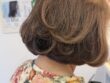 ワンレングスボブにパーマをかけてブローでふんわり仕上げた白髪染めスタイル